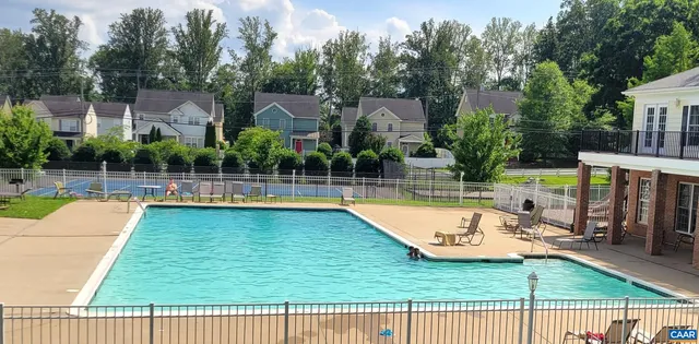 a view of a swimming pool with a patio