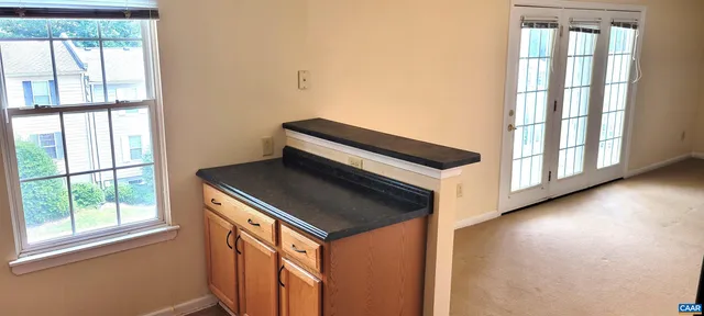 a view of an entryway and wooden floor