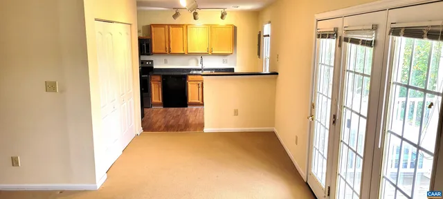 a view of a kitchen from a hallway