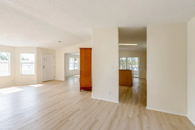 a kitchen with stainless steel appliances granite countertop sink stove and cabinets