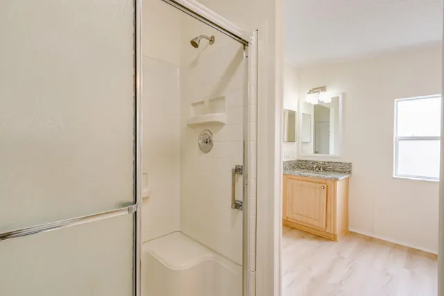 a view of a swimming pool with a lounge chair