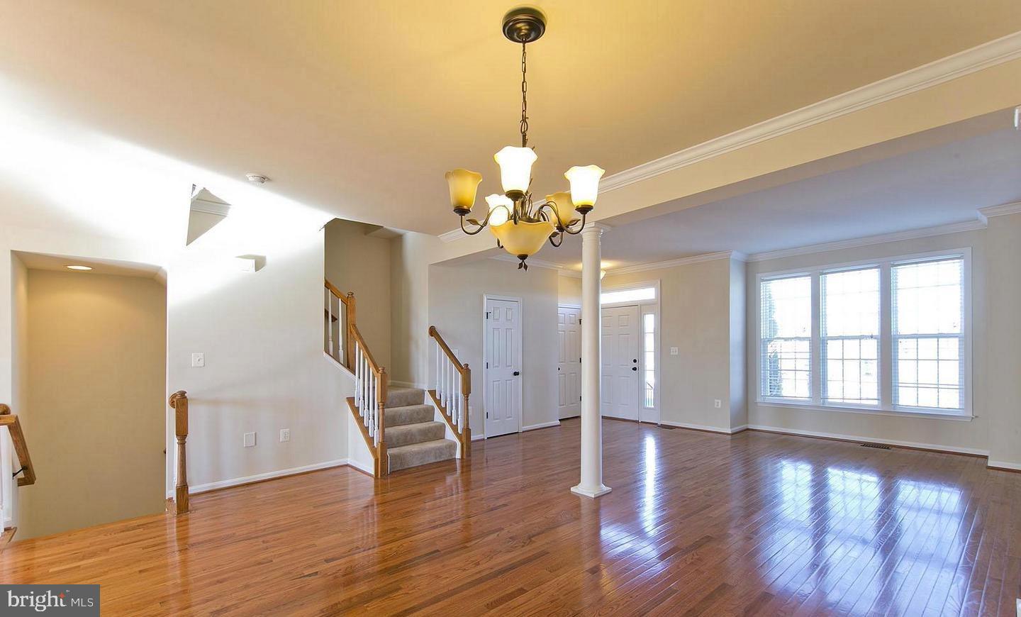 73 Spoon Square Front Royal, VA 22630 - Photo 16 of 28 a view of a room with wooden floor and chandelier