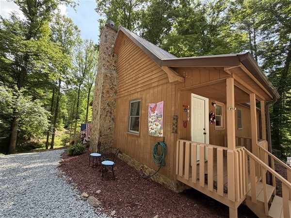238 Trails End Road Blue Ridge, GA 30513 - Photo 26 of 32 a view of a small house with yard