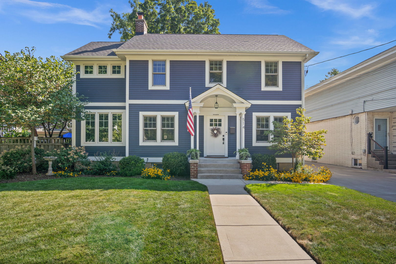 514 Main Street Batavia, IL 60510 - Photo 1 of 1 a front view of a house with garden