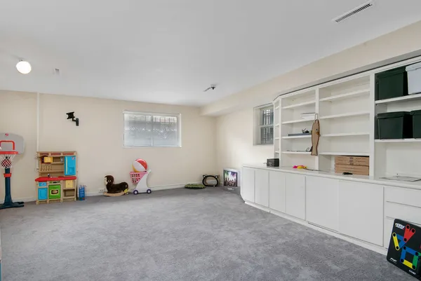 a view of game room with window and couch