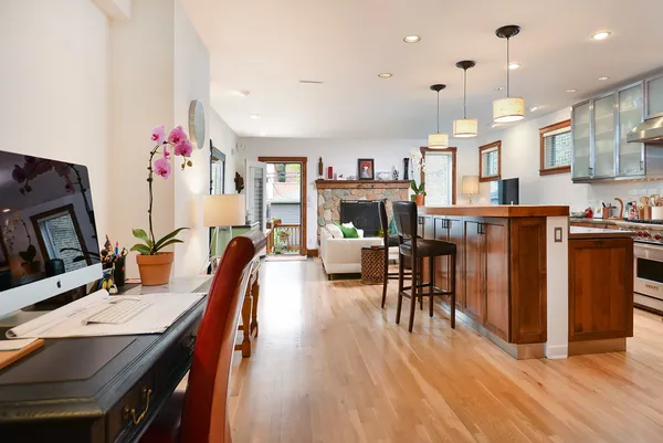 a living room with fireplace furniture and a flat screen tv