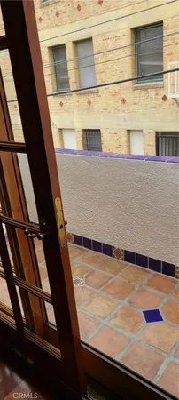 a bathroom with a sink a toilet a mirror and shower