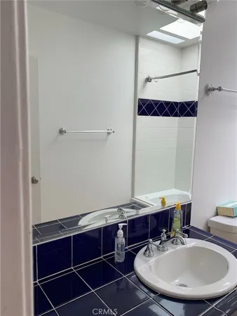 a bathroom with a shower and a toilet