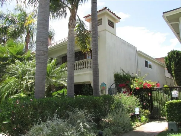 a sign that is sitting in front of flowers