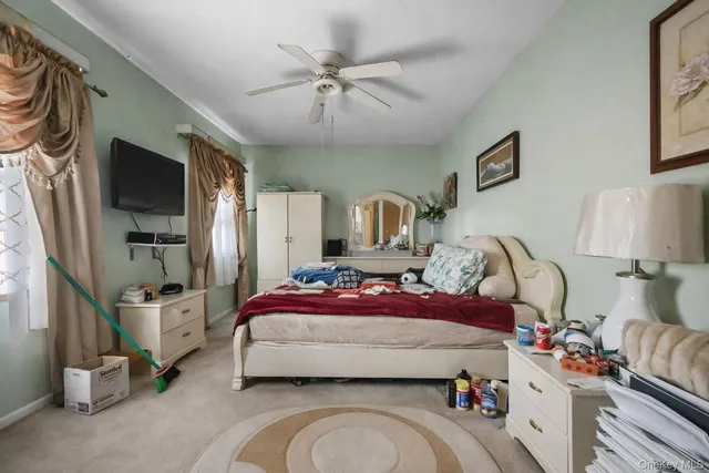 a bedroom with a bed and flat screen tv
