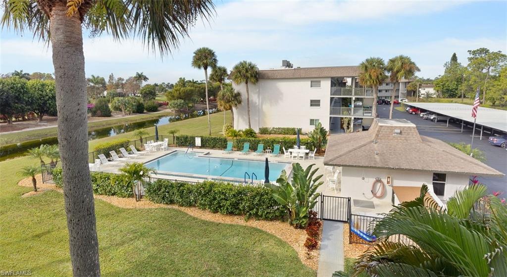 5683 Rattlesnake Hammock Road, Unit A202 Naples, FL 34113 - Photo 18 of 19 Heated community pool