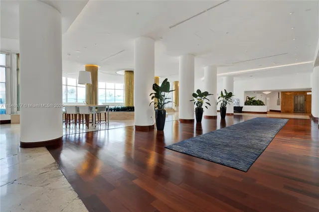 a view of a bathroom with tub and windows