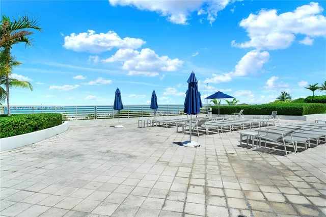 a view of a lake with houses in the back