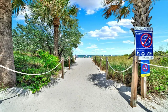 a view of swimming pool and an outdoor seating