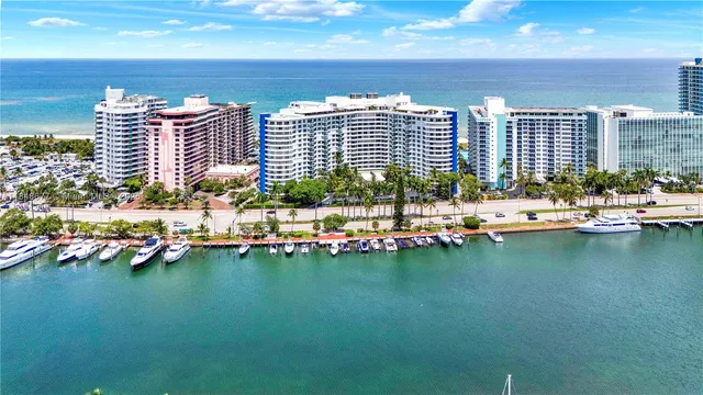 a view of swimming pool with outdoor seating and lake view