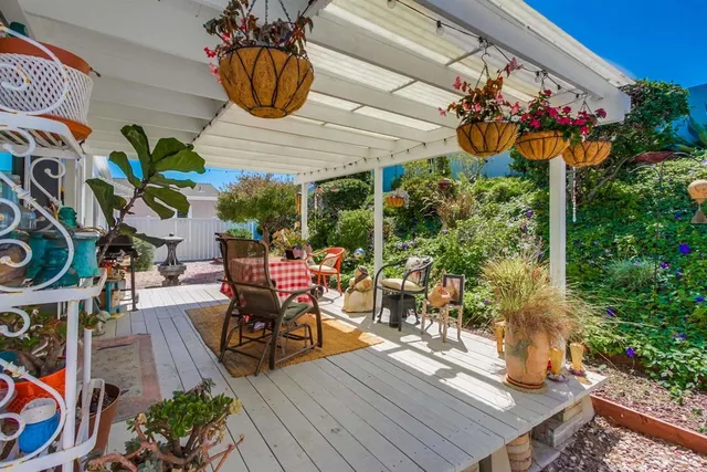 a view of a dining room with furniture wooden floor and a chandelier
