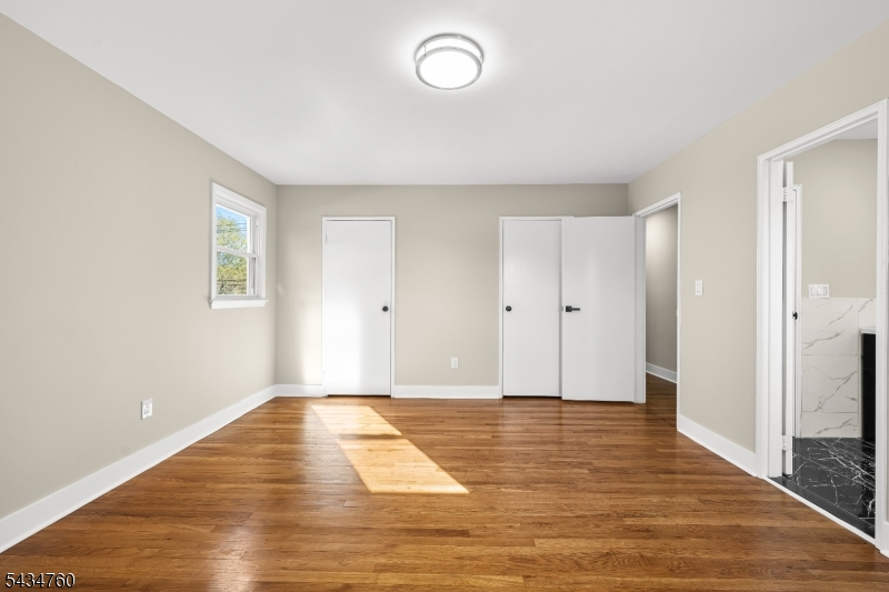 641 Ydv-ham Sq Road Robbinsville, NJ 08691 - Photo 14 of 49 a view of an empty room with wooden floor and a window
