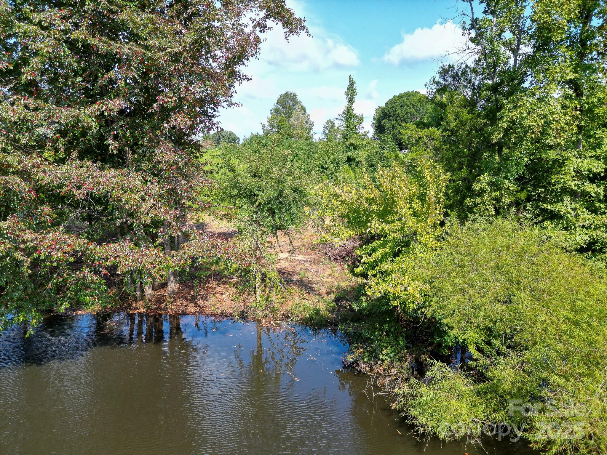 0 South Providence Road South, Unit 2 Waxhaw, NC 28173 - Photo 16 of 33 a view of a lake from a yard