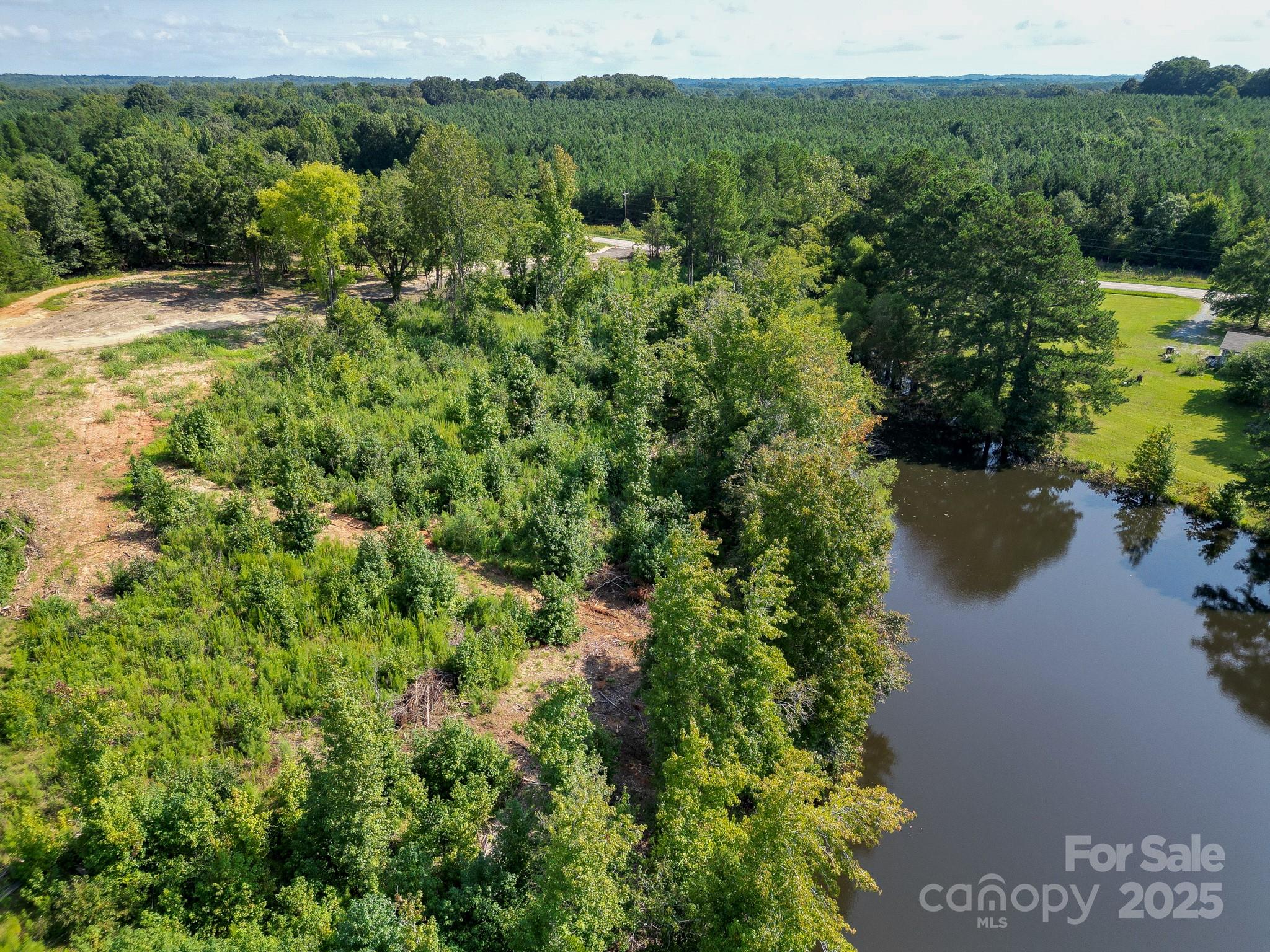 0 South Providence Road South, Unit 2 Waxhaw, NC 28173 - Photo 3 of 33 a view of a lake with a yard