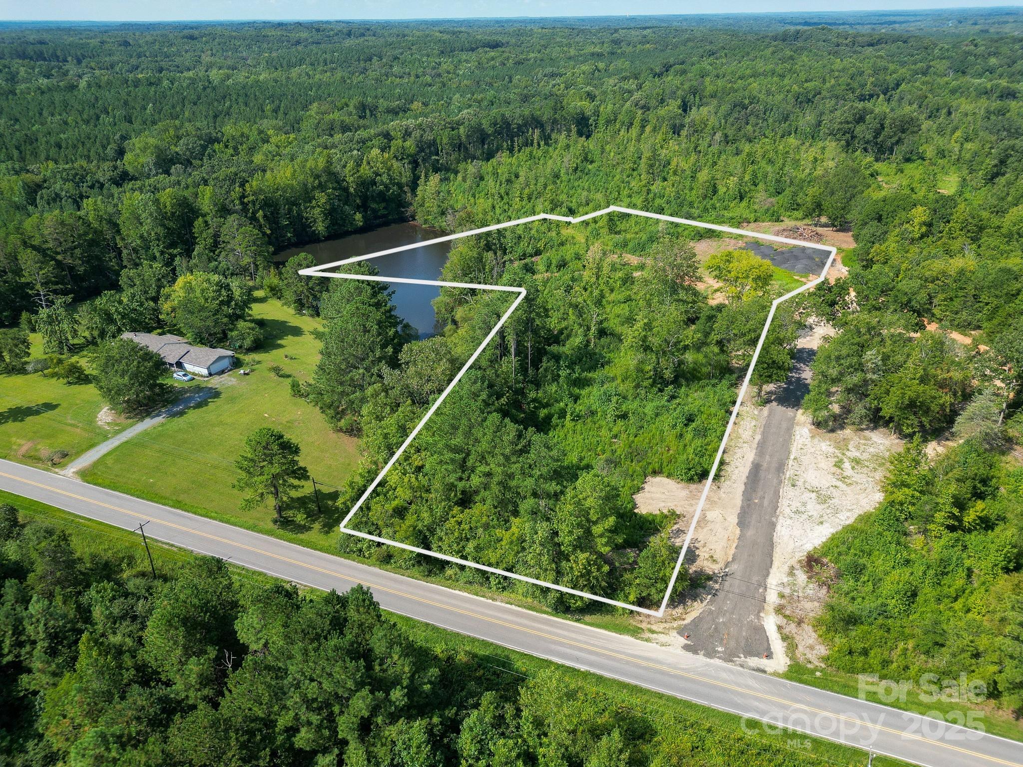 0 South Providence Road South, Unit 2 Waxhaw, NC 28173 - Photo 5 of 33 a view of a yard with a street