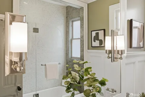 a bathroom with a bathtub and a shower