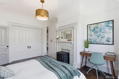 a bedroom with bed and a window