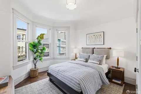 a bedroom with a bed and a view of bedroom