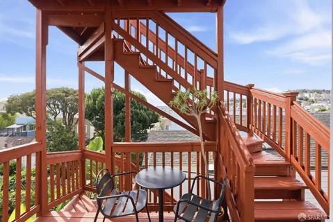 a view of a patio with two couches chairs and potted plants