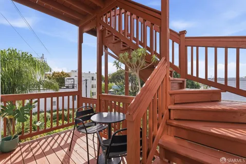 a view of balcony with couch and outdoor seating