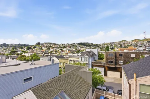 a view of a city with a building in the background