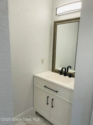 a bathroom with a sink and a vanity