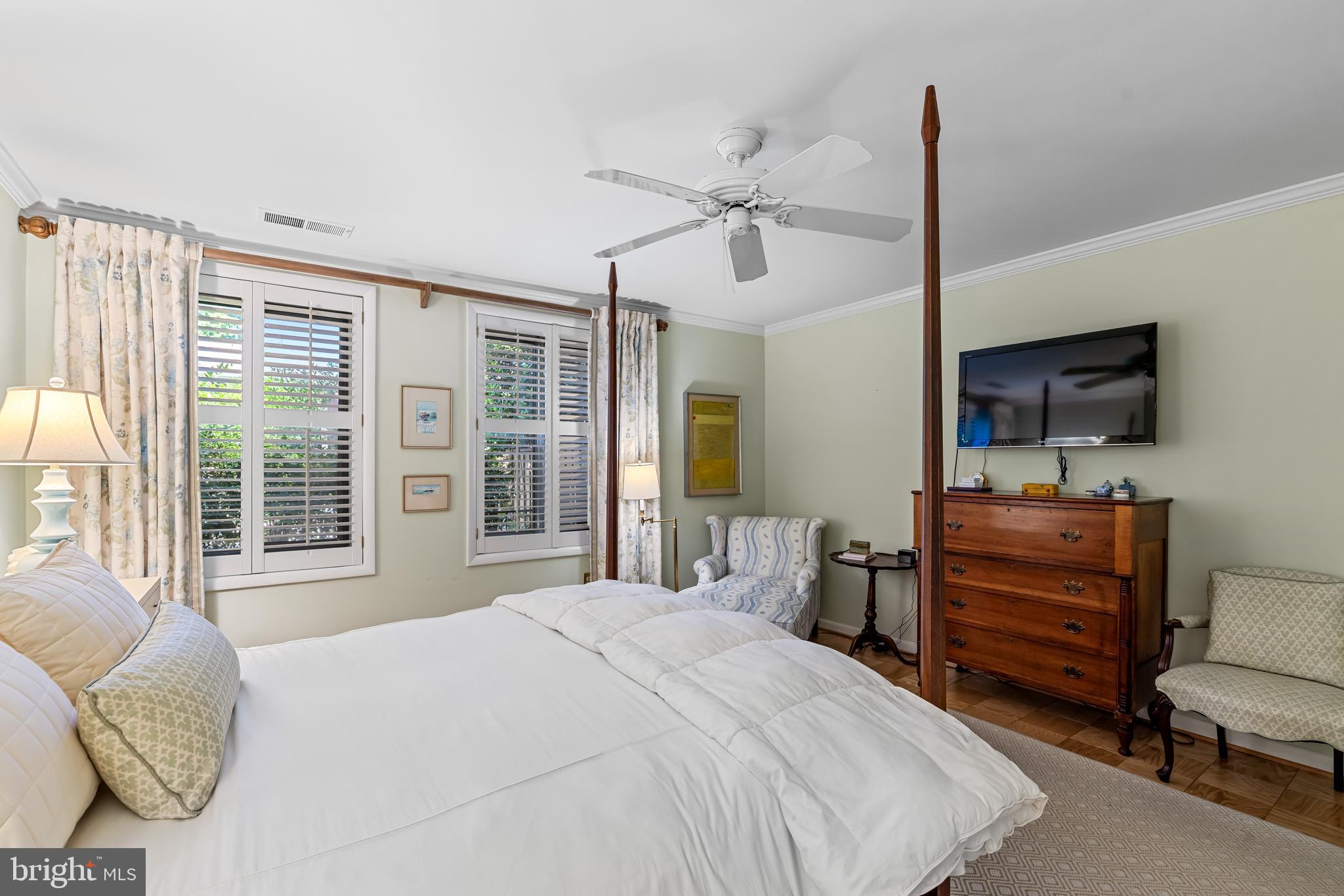 1 Cross Keys Road, Unit 1A Baltimore, MD 21210 - Photo 27 of 52 Interior shutters, ceiling fan and large windows.