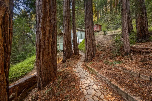 a view of a kitchen with wooden floor and a kitchen