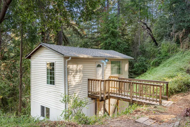 a view of a kitchen with sink and window