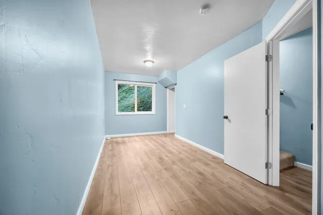a bathroom with a sink a toilet and a window