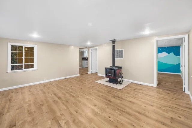a view of a room with gym equipment and a window