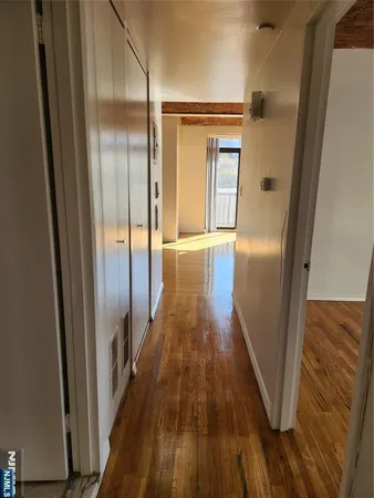 a view of gallery with wooden floor