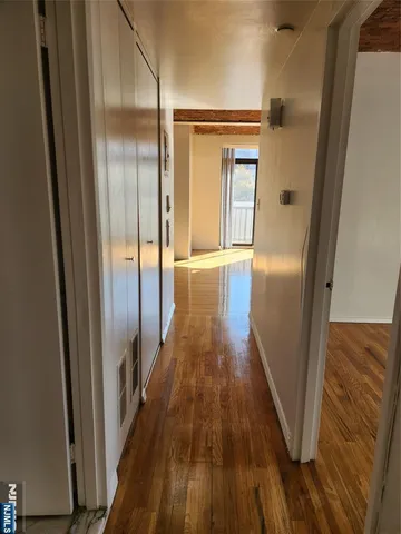 a view of gallery with wooden floor