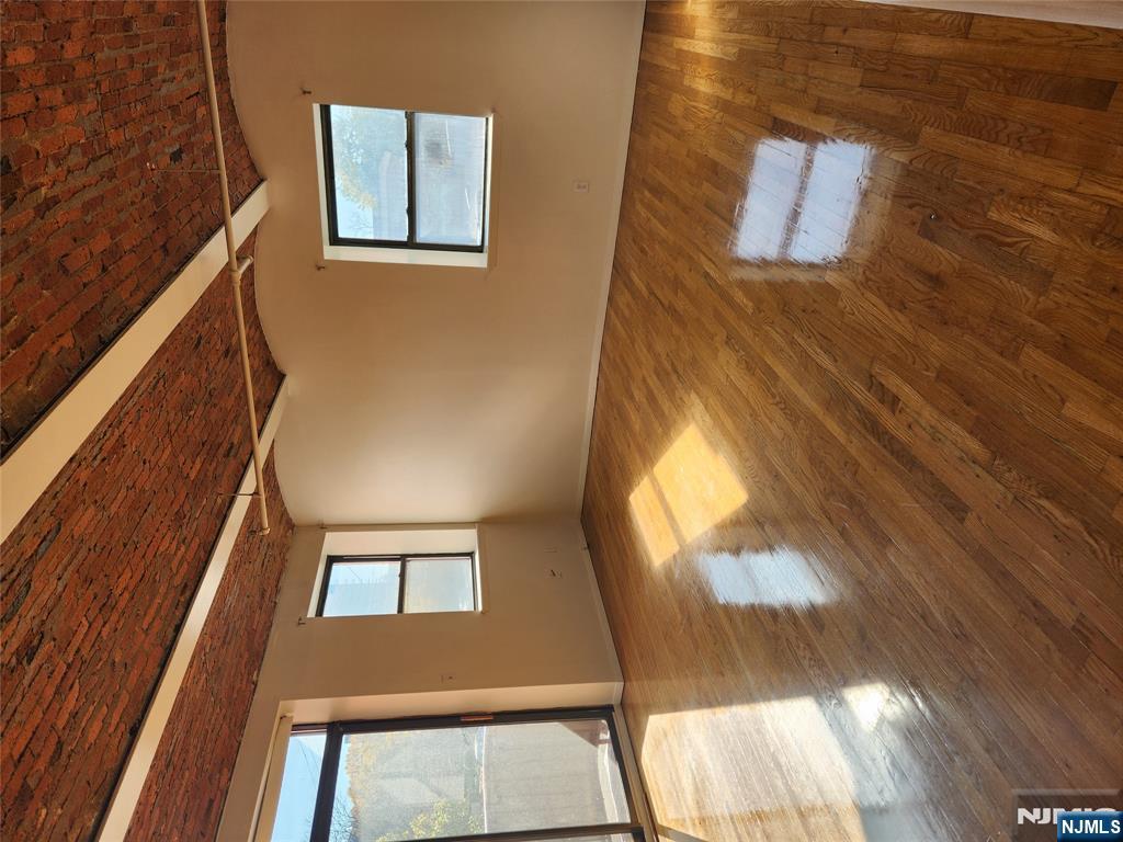 840 River Road, Unit 207 Edgewater, NJ 07020 - Photo 10 of 13 a view of empty room with wooden floor