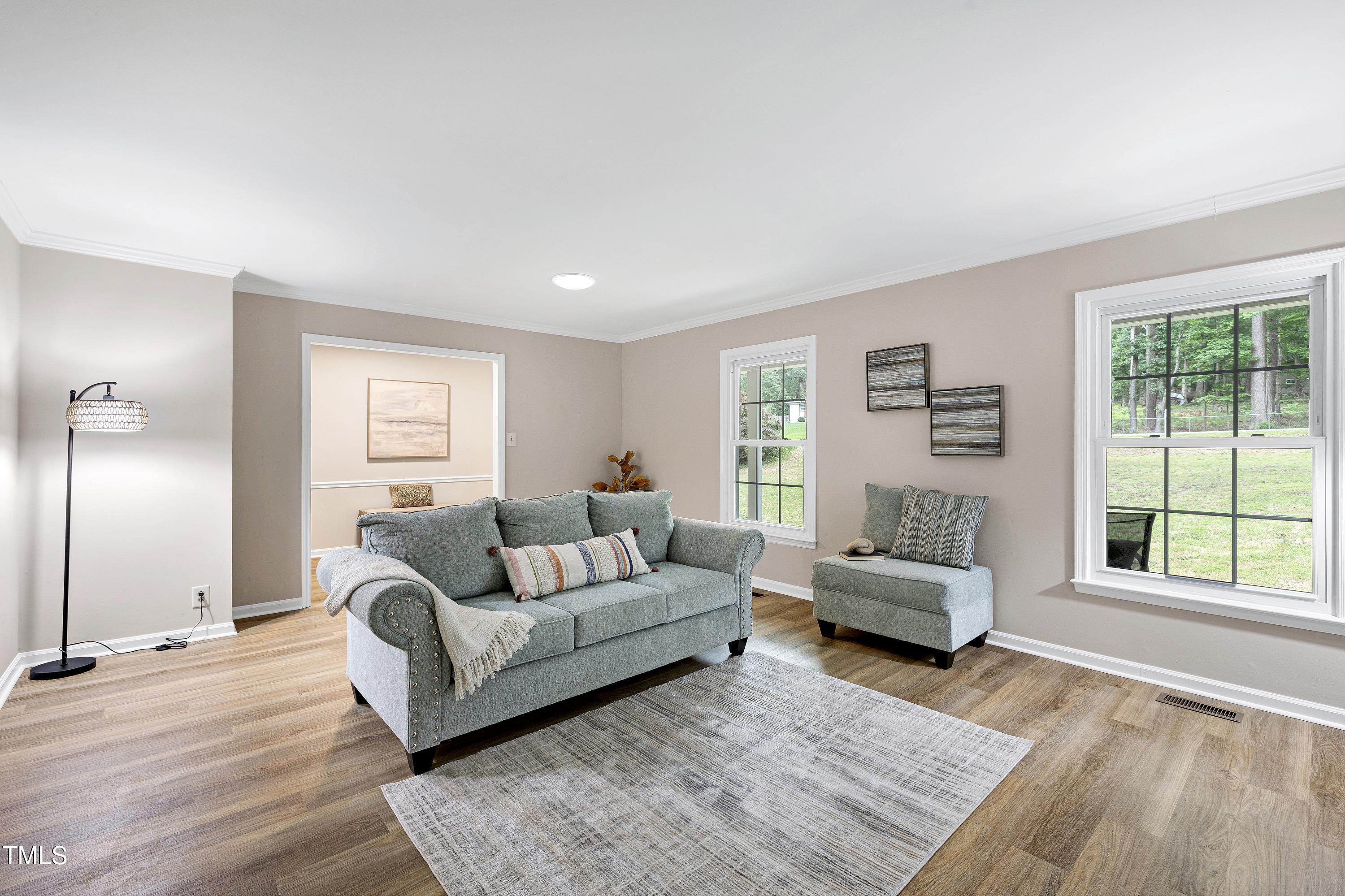 5121 Raintree Road Durham, NC 27712 - Photo 14 of 59 a living room with furniture and a window