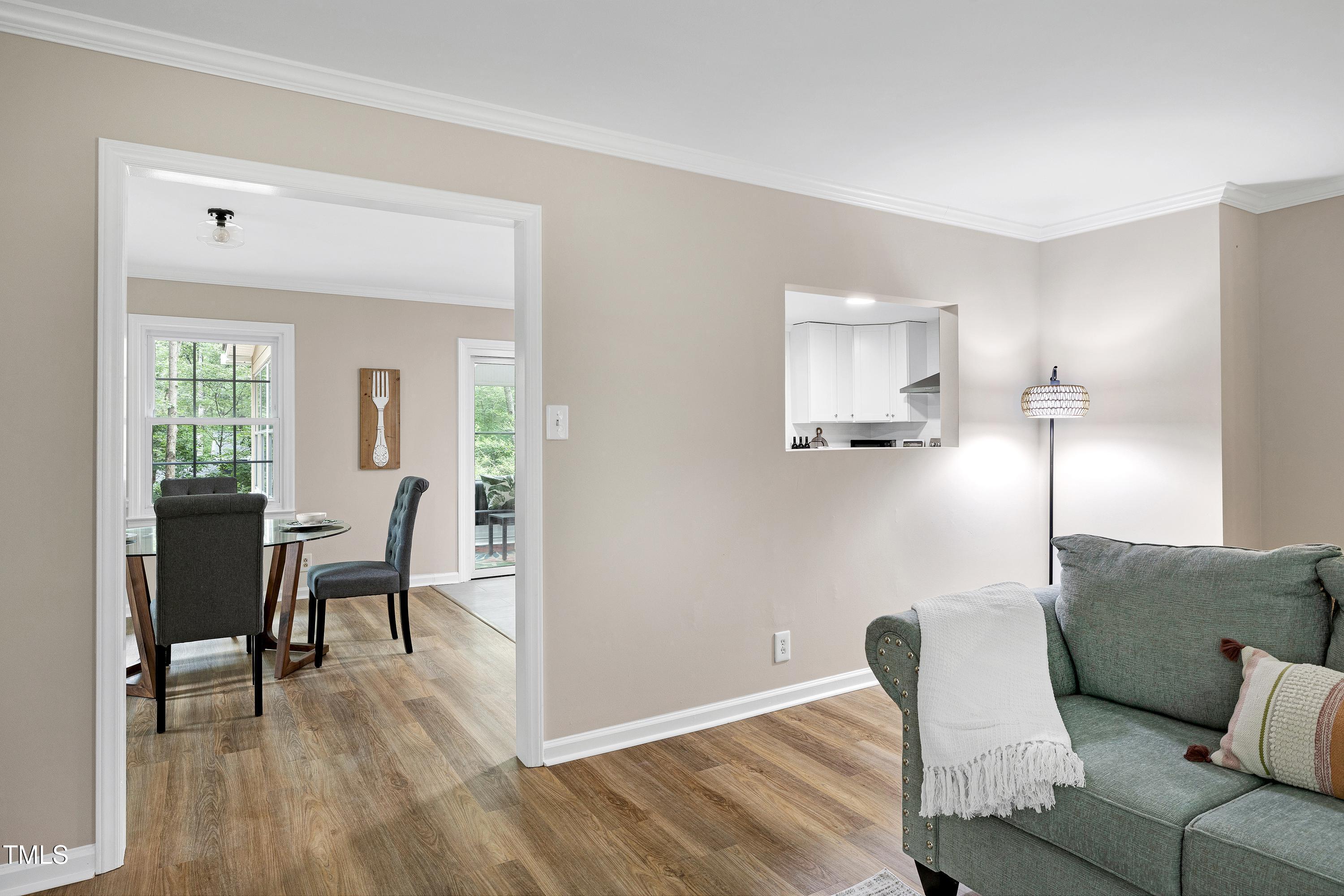5121 Raintree Road Durham, NC 27712 - Photo 15 of 59 a view of a livingroom with furniture and wooden floor