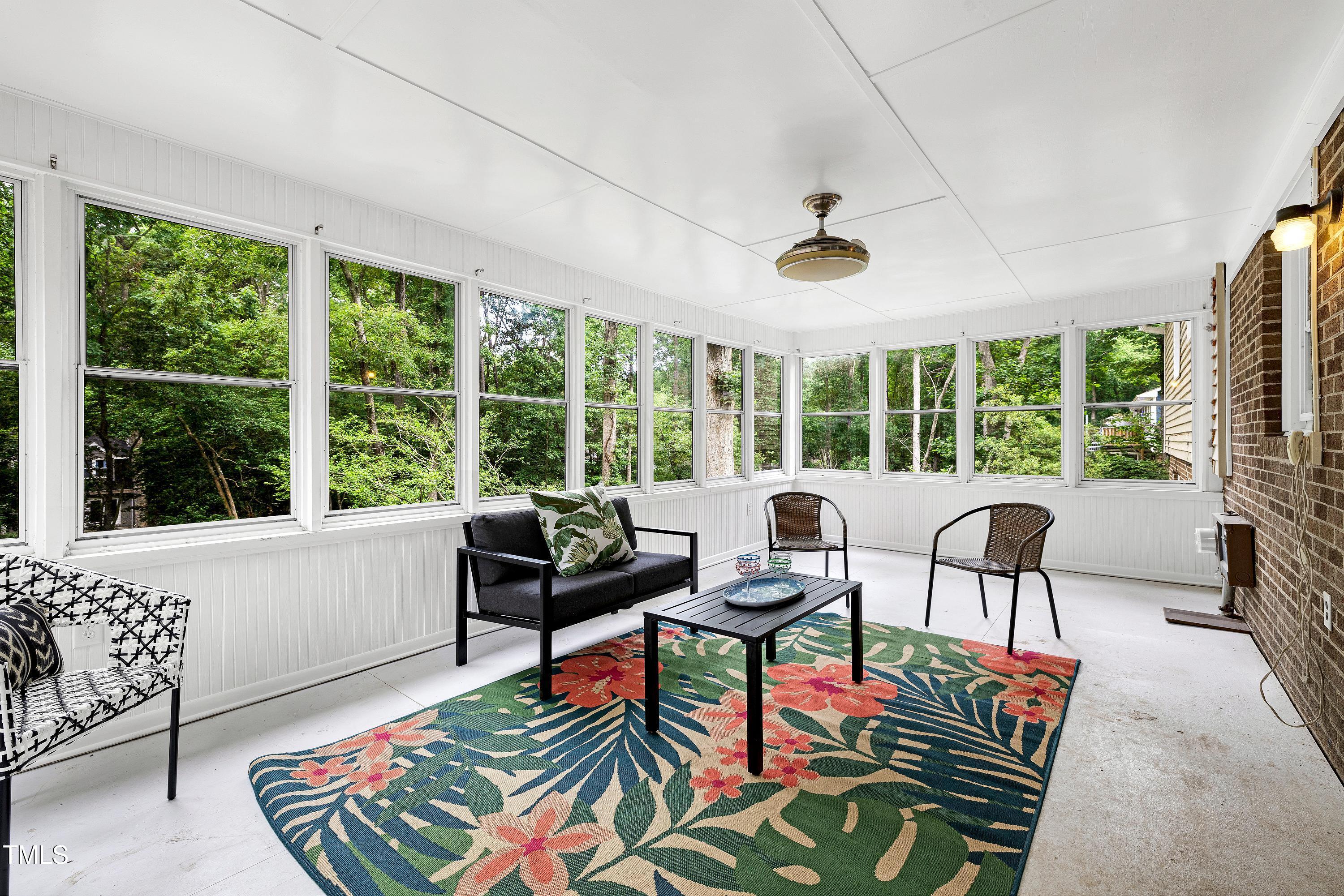 5121 Raintree Road Durham, NC 27712 - Photo 25 of 59 a living room with furniture and a large window