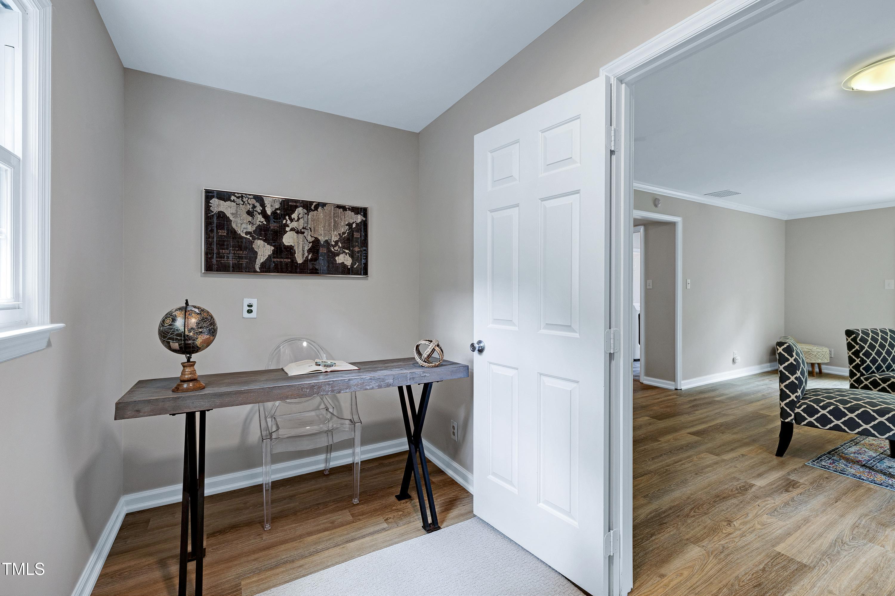 5121 Raintree Road Durham, NC 27712 - Photo 43 of 59 a view of a workspace with furniture and wooden floor