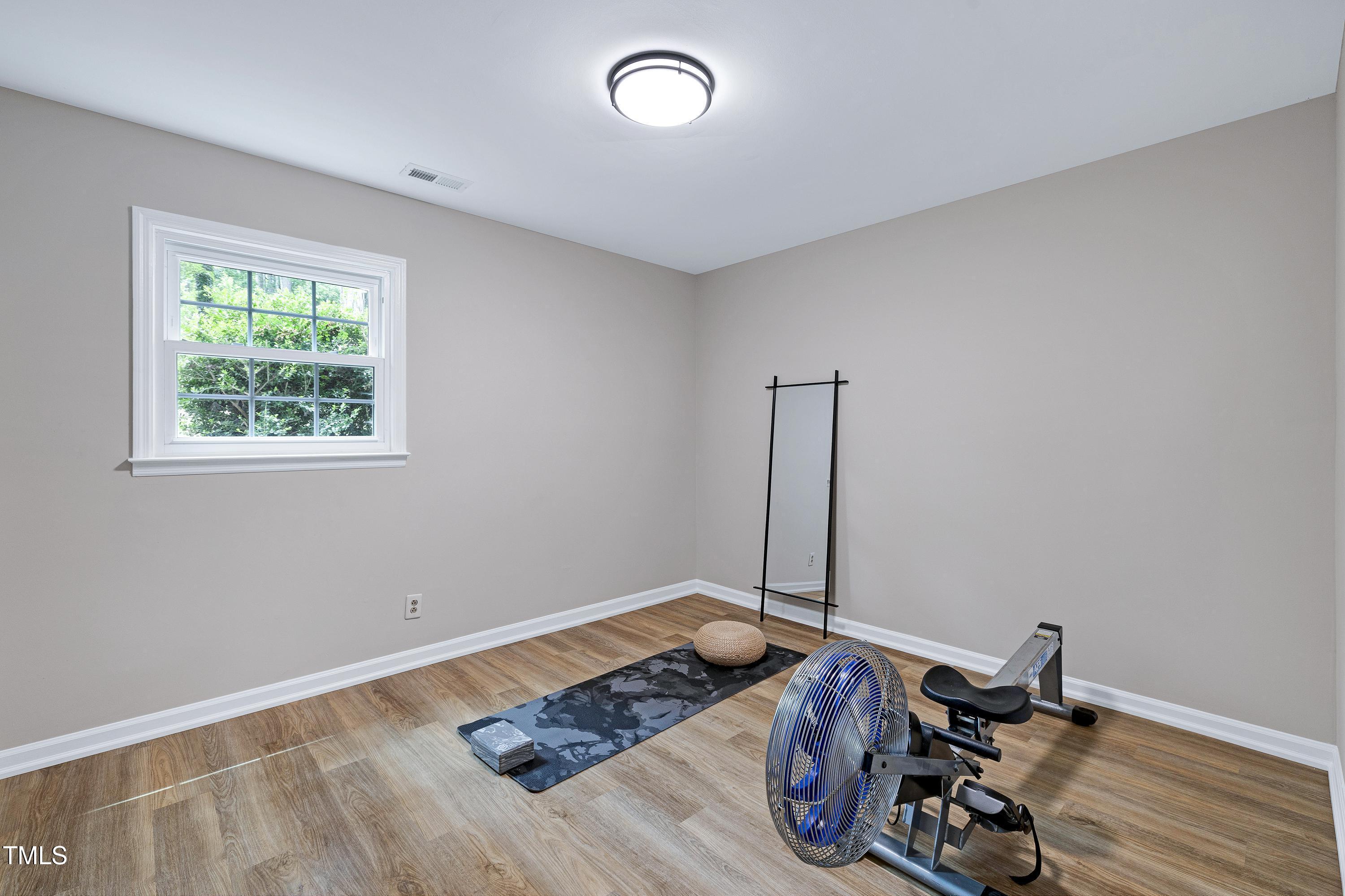 5121 Raintree Road Durham, NC 27712 - Photo 45 of 59 a living room with hard wood floor and a window