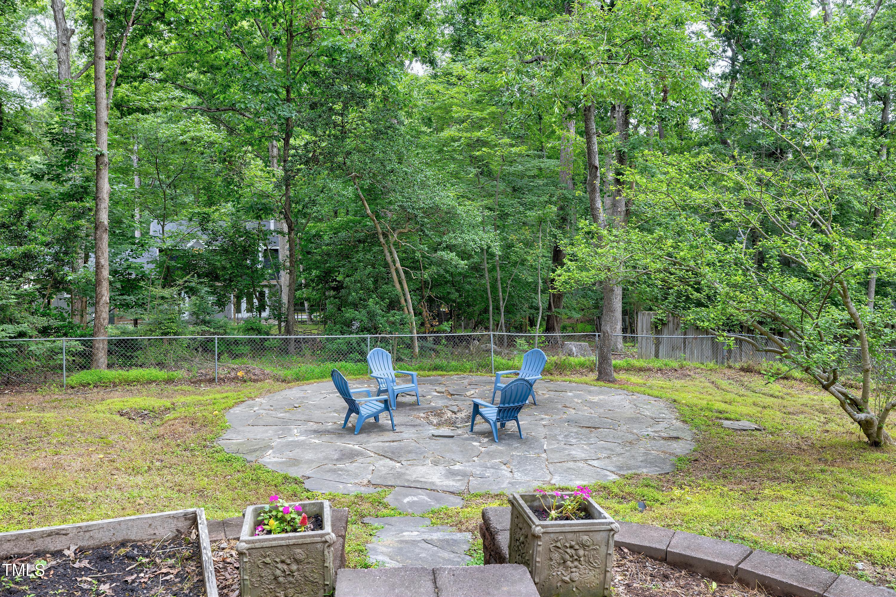 5121 Raintree Road Durham, NC 27712 - Photo 53 of 59 a view of backyard with swimming pool and sitting area