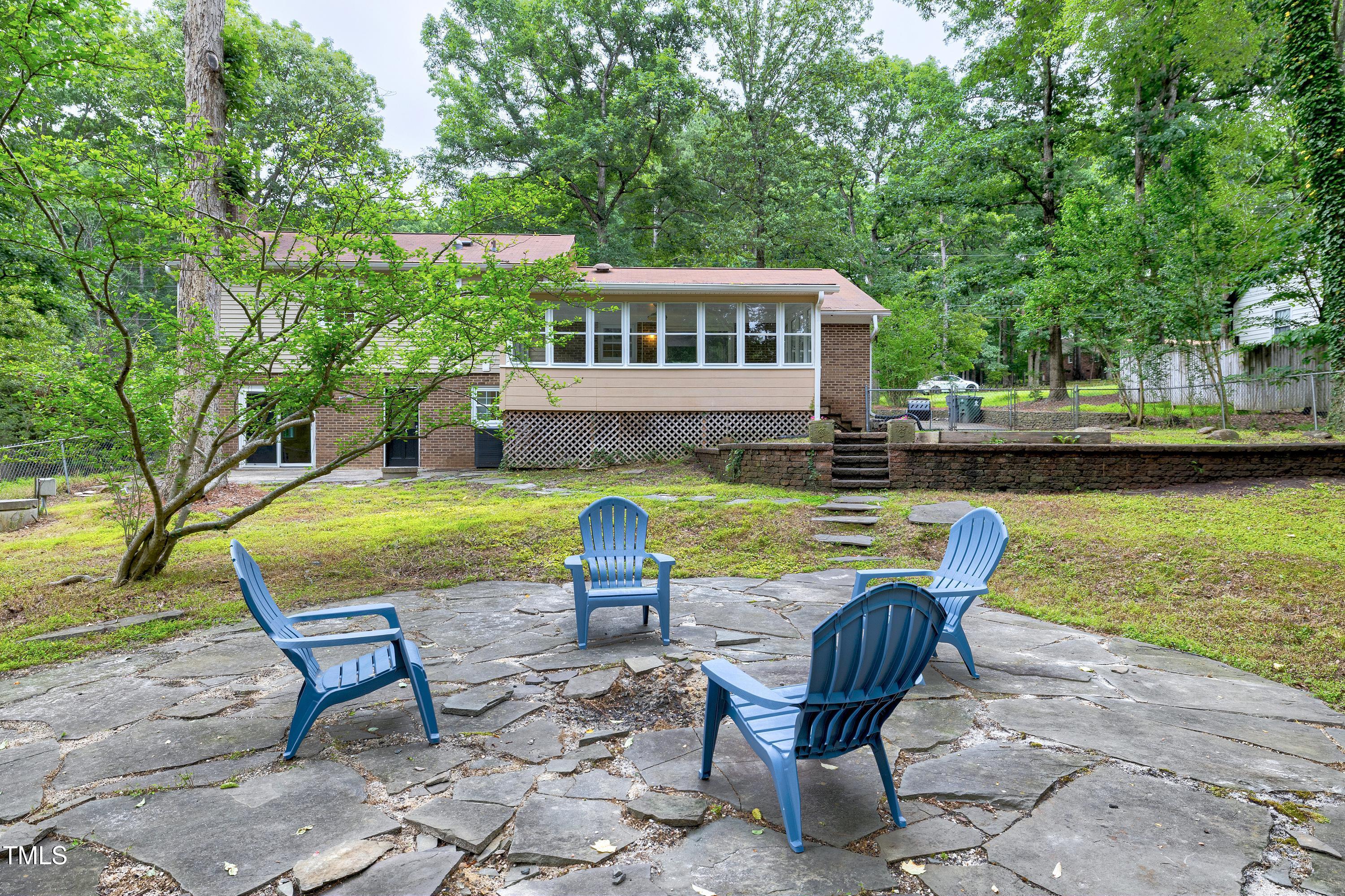 5121 Raintree Road Durham, NC 27712 - Photo 55 of 59 a view of a house with backyard and sitting area