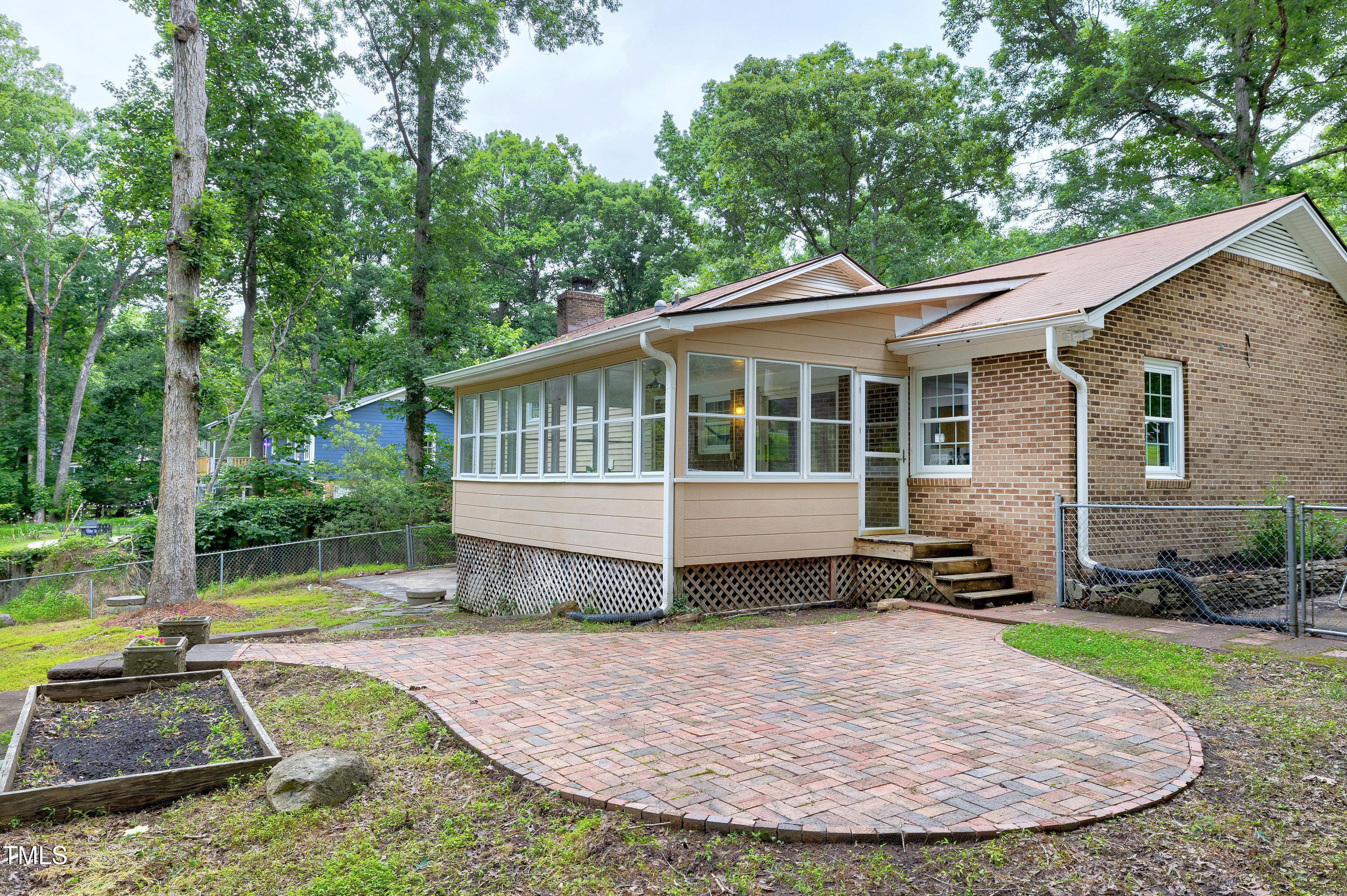 5121 Raintree Road Durham, NC 27712 - Photo 59 of 59 a view of a house with backyard and trees