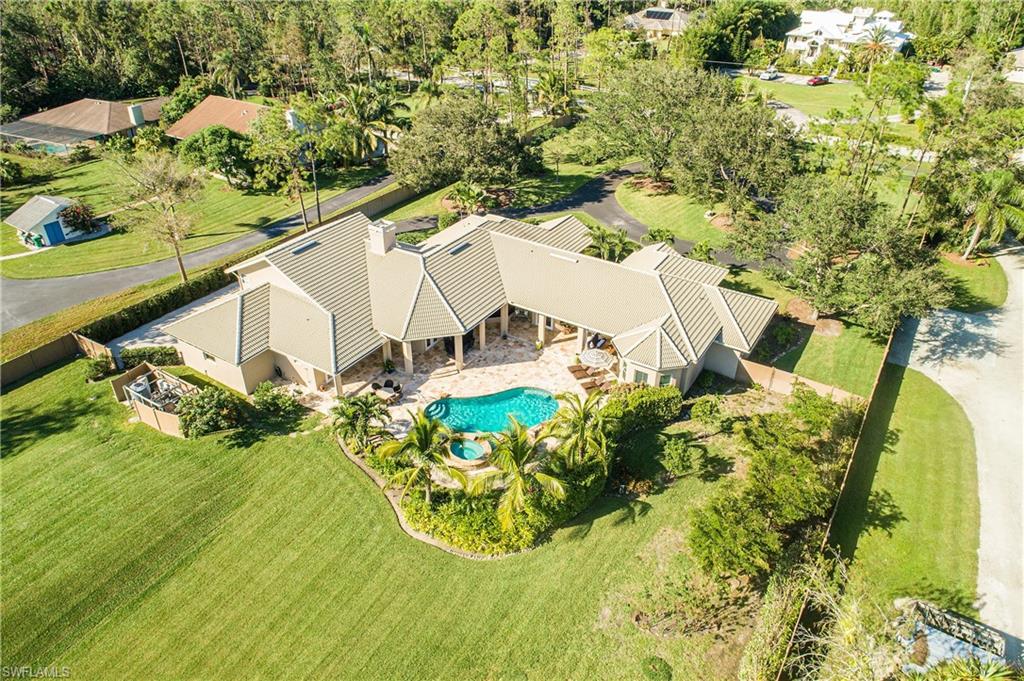 6610 Sable Ridge Lane Naples, FL 34109 - Photo 17 of 50 an aerial view of a house with yard swimming pool and outdoor seating