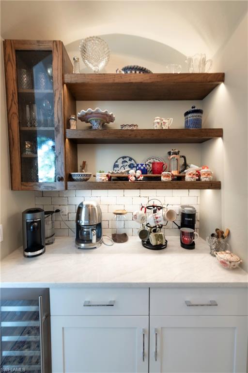 6610 Sable Ridge Lane Naples, FL 34109 - Photo 18 of 50 a kitchen with a stove and cabinets