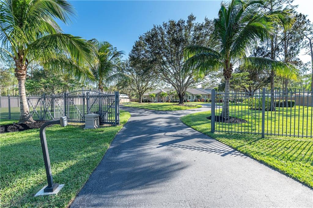 6610 Sable Ridge Lane Naples, FL 34109 - Photo 23 of 50 a view of a park with palm trees